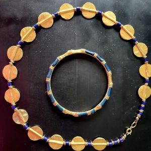 Egyptian Vintage 2 piece set. Gold plates with navy blue beads and tones.